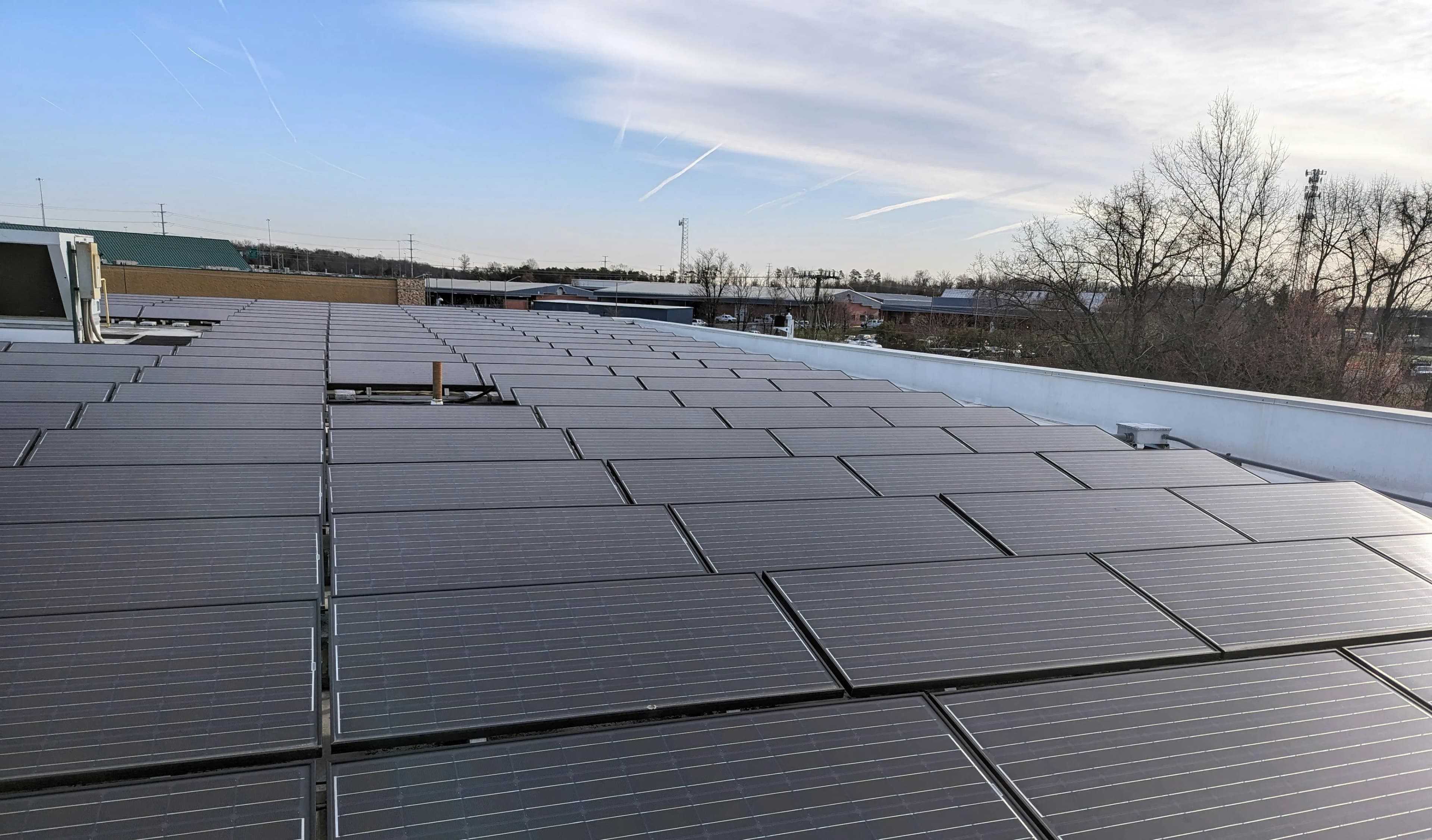 Rooftop solar panels capturing sunlight, contributing to eco-friendly energy solutions.
